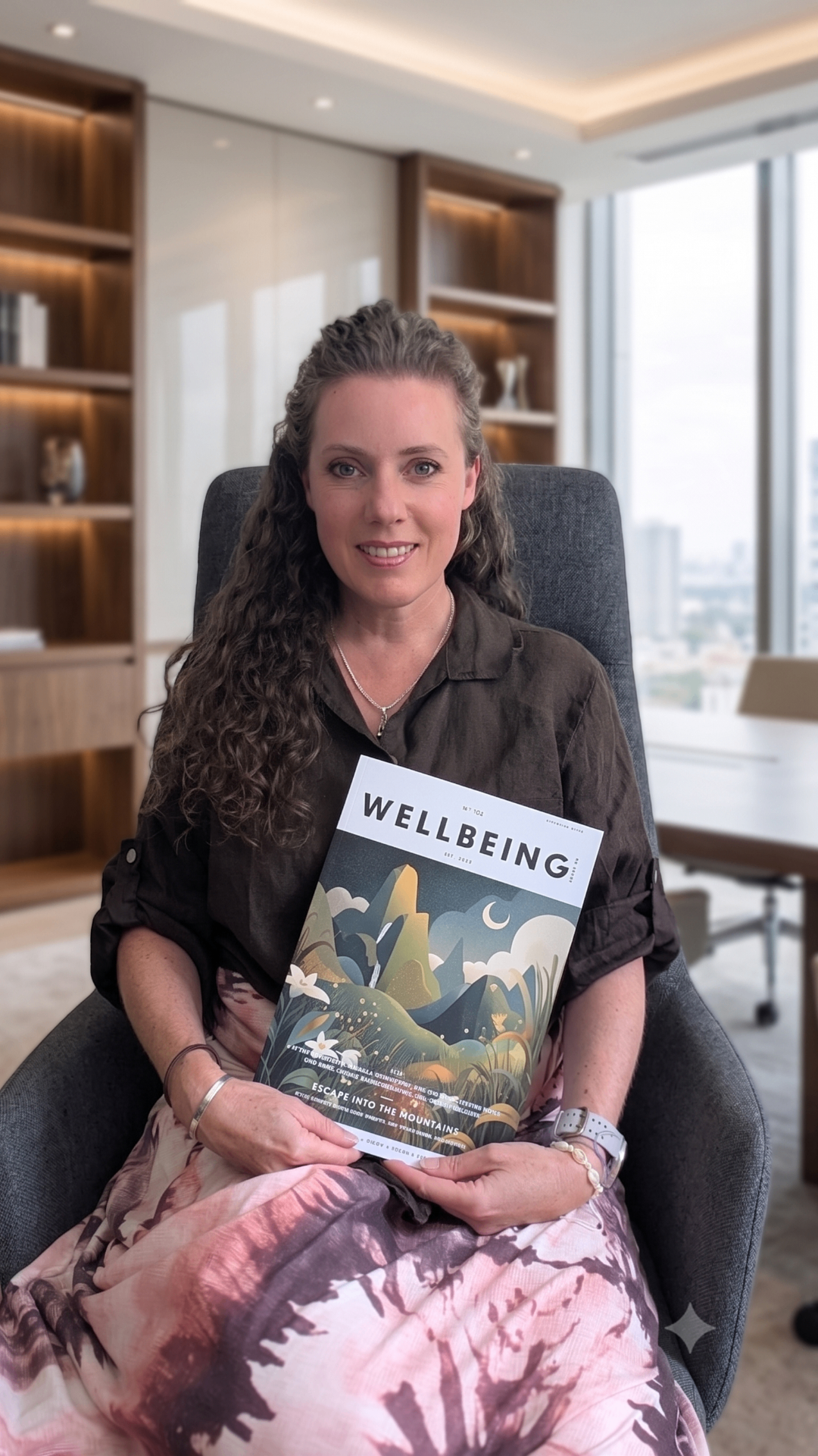 Rachel Branson holding Wellbeing Magazine